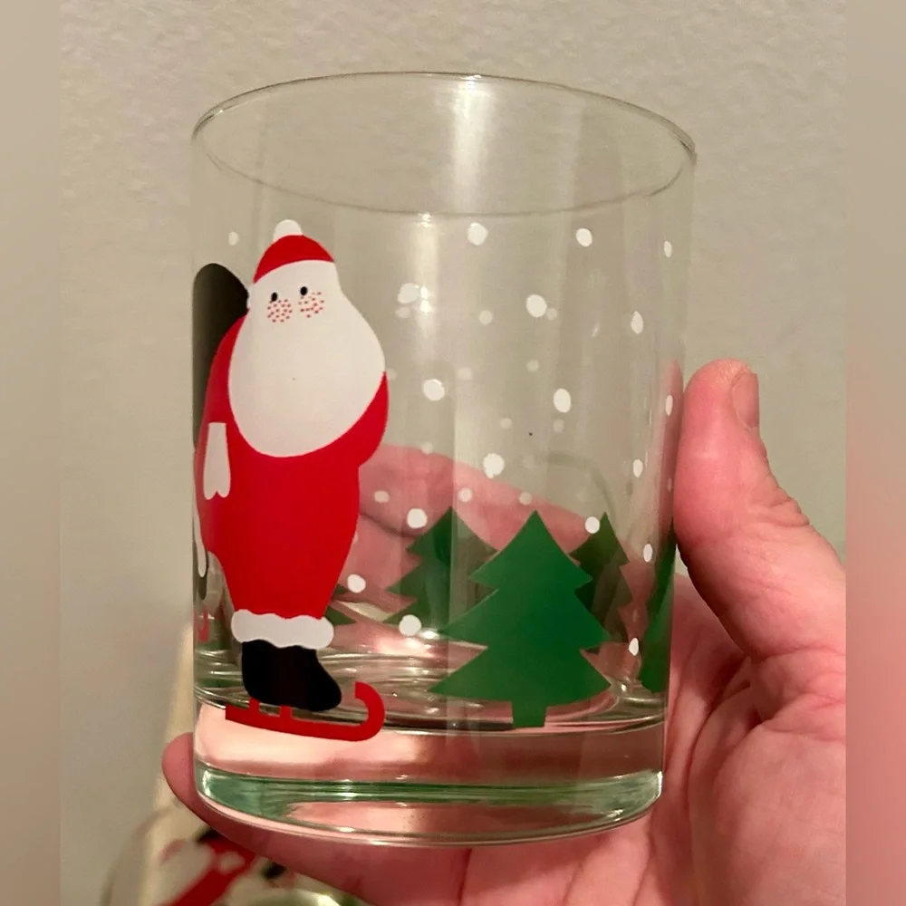 8 Crate & Barrel vintage skating Santa lowball glasses. 12oz